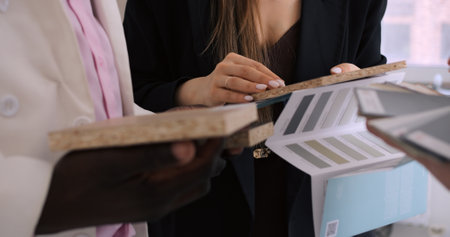 Specialist designer selects color for home facades and wall paint for renovation. Expert choice of color offers best color solutions for homes and apartments. Ideal color choice emphasizedの写真素材