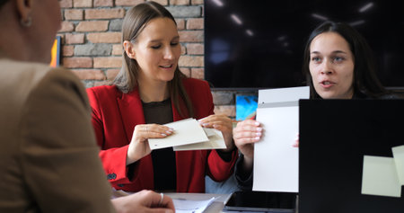 Team of engineers and architects in construction company managing project. Focusing on safety, budget, and logistics to deliver high-quality building within set timeline and specifications.の写真素材