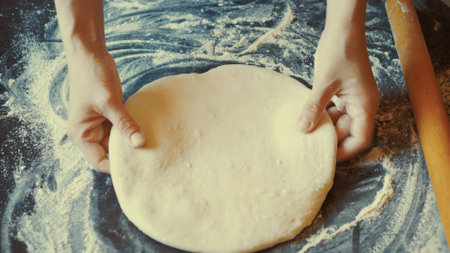 Traditional pasta dough prepared with care, perfect for creating delicious ravioli or tagliatelle. Freshly made pasta elevates any meal, offering rich taste and delightful texture.の写真素材