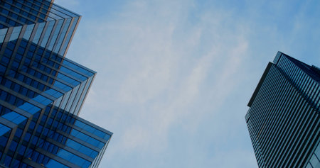 Skyscrapers Stretching Upward Towards Blue Sky Reflecting Modern Architecture Capturing Urban...