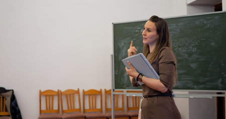 Educator explains concepts to engaged students, fostering learning and collaboration. Classroom...