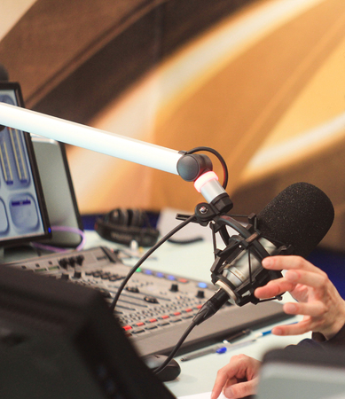 female Presenter in radio station hosting show for radio live in Studioの写真素材