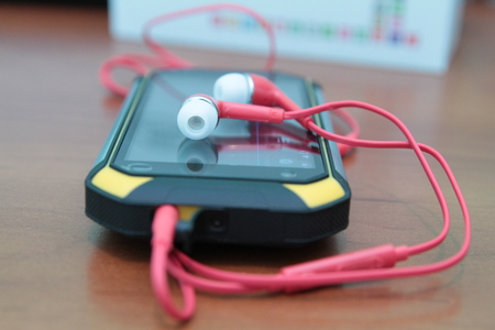 smartphone and headphones, side view, closeup special photo effect - soft focus, vignetteの写真素材
