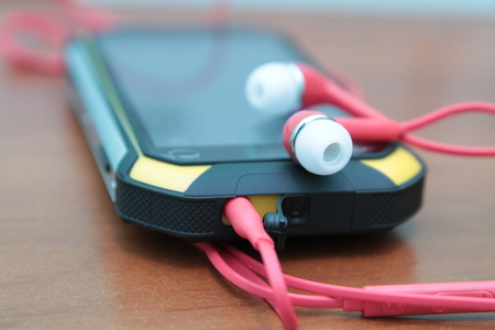 smartphone and headphones, side view, closeup special photo effect - soft focus, vignetteの写真素材