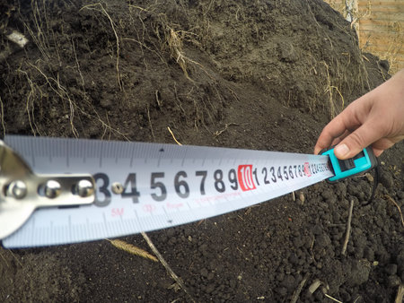 Building rouletteon, outdoors. Construction roulette on the land. Earth measurementの写真素材