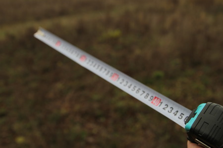 Building rouletteon, outdoors. Construction roulette on the land. Earth measurementの写真素材