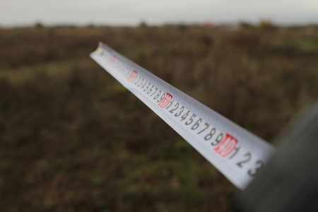 Building rouletteon, outdoors. Construction roulette on the land. Earth measurementの写真素材
