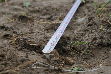 Building rouletteon, outdoors. Construction roulette on the land. Earth measurementの写真素材