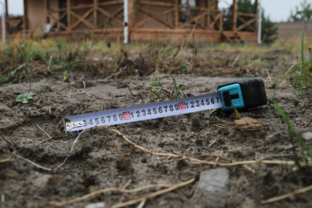 Building rouletteon, outdoors. Construction roulette on the land. Earth measurementの写真素材
