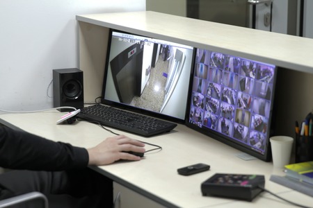 Man In Control Room Monitoring Multiple Cctv Footage.の写真素材