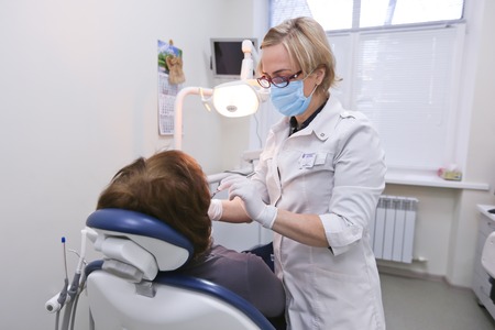 Students practicing dentistry on medical dummies in a teaching facility or universityのeditorial素材