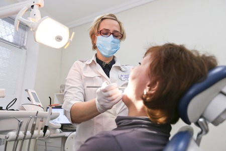 Students practicing dentistry on medical dummies in a teaching facility or universityのeditorial素材