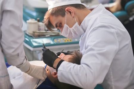 Students practicing dentistry on medical dummies in a teaching facility or universityのeditorial素材