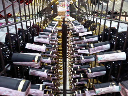 Kiev, March 6, 2018, Ukraine. Bottles with alcohol in the supermarket. Bottles with wine and...
