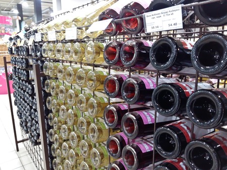 Kiev, March 6, 2018, Ukraine. Bottles with alcohol in the supermarket. Bottles with wine and champagne in the supermarket.のeditorial素材