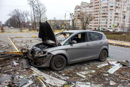 Bucha, Kyiv region, Ukraine - April 5, 2022: War between Russia and Ukraine. The consequences of the war, the damaged car of civilians by the troops of the Russian army. shot car.のeditorial素材