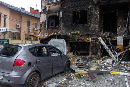 Bucha, Kyiv region, Ukraine - April 5, 2022: War between Russia and Ukraine. The consequences of the war, the damaged car of civilians by the troops of the Russian army. shot car.のeditorial素材