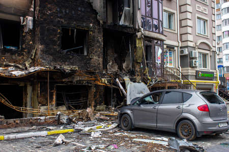 Bucha, Kyiv region, Ukraine - April 5, 2022: War between Russia and Ukraine. The consequences of the war, the damaged car of civilians by the troops of the Russian army. shot car.のeditorial素材