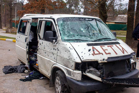 Bucha, Kyiv region, Ukraine - April 5, 2022: War between Russia and Ukraine. The consequences of the war, the damaged car of civilians by the troops of the Russian army. shot car.のeditorial素材