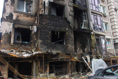 Bucha, Kyiv region, Ukraine - April 5, 2022: War between Russia and Ukraine. The consequences of the war, the damaged car of civilians by the troops of the Russian army. shot car.のeditorial素材