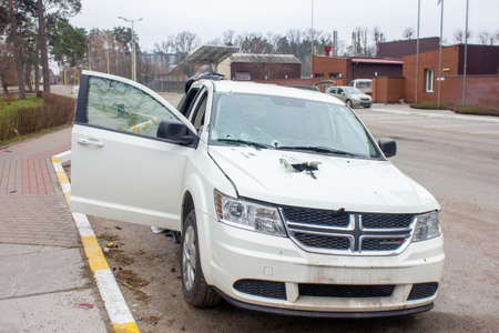 Bucha, Kyiv region, Ukraine - April 5, 2022: War between Russia and Ukraine. The consequences of the war, the damaged car of civilians by the troops of the Russian army. shot car.のeditorial素材