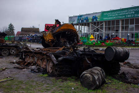 Berezovka, Kyiv region, Ukraine - April 2022: Russia Ukraine War. Bombed military equipment on the highway. Exploded Russian tank on the highway.のeditorial素材