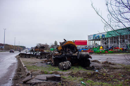 Berezovka, Kyiv region, Ukraine - April 2022: Russia Ukraine War. Bombed military equipment on the highway. Exploded Russian tank on the highway.のeditorial素材