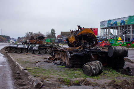 Berezovka, Kyiv region, Ukraine - April 2022: Russia Ukraine War. Bombed military equipment on the highway. Exploded Russian tank on the highway.のeditorial素材