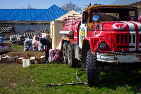 Velyka Dymerka, Kyiv region, Ukraine - April 2022: War Ukraine Russia. Volunteers collect food for...