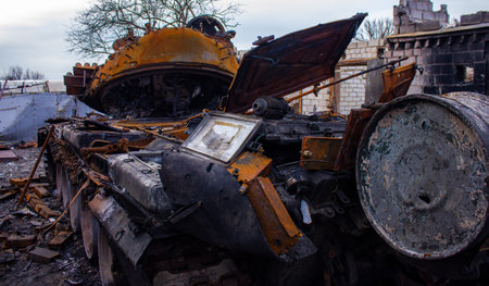 Velyka Dymerka, Kyiv region, Ukraine - April 2022: War Ukraine Russia. The ruins of the house after the bombing by the Russian army. Destroyed tank and house after a missile attack. The consequences oのeditorial素材