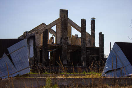 Velyka Dymerka, Kyiv Oblast, Ukraine - April 2022: War Ukraine Russia. Ruins of a house after being bombed by the Russian army. Destroyed house after a missile strike. Consequences of the explosionのeditorial素材