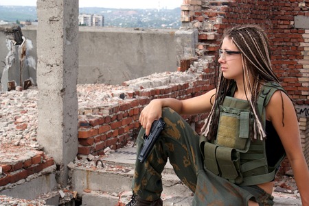 Portrait of the young woman. A military uniform. Gogglesの写真素材