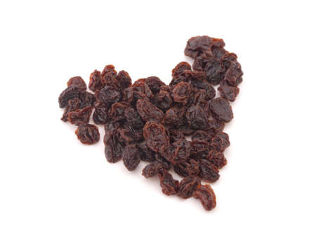 Heart from raisins on a white backgroundの写真素材