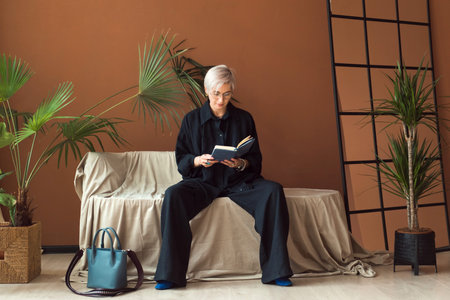 fashion woman in black shirt working in modern work place or office with notepad