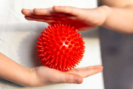 kid holding massage ball physical therapy and massageの写真素材