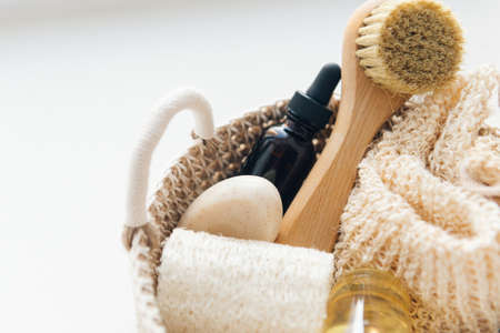 cosmetics products in bathroom - towel, serum dropped bottle, face brush and exfoliation soapの写真素材