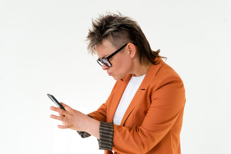 Happy queer person holding mobile funny faceの写真素材