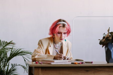 graphic designer girl red color hair sketchingの写真素材