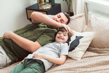 Loving father embracing boy with Down syndromeの写真素材