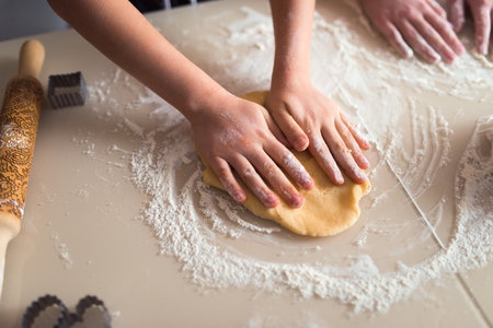 Making cookies at home, two girls cooking together, using modeling splinterの写真素材