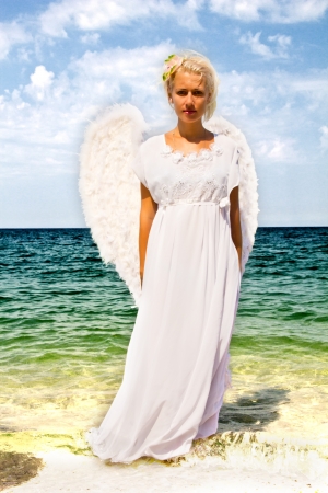 The photo shows a beautiful girl dressed as an angel.の写真素材