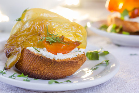 Bruschetta with cherry tomatoes, sweet pepper, mozzarella cheese and marjoramの写真素材