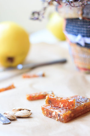 Pieces of quince jam. Delicious paste over the brown paper.