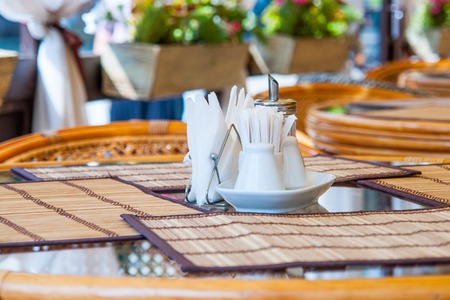 Table served for dinner in a street restaurant or cafe.の写真素材