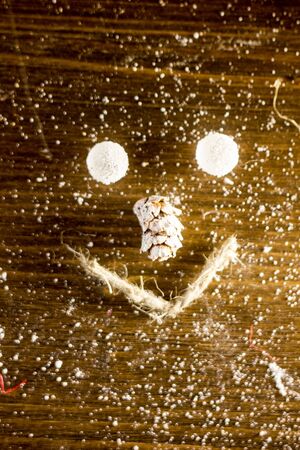 Christmas smilie made with balls, rope and fir cone.の写真素材