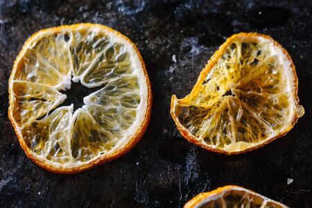 Dried orange over the black metal boardの写真素材