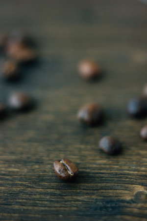 Coffee beans on the black wooden board