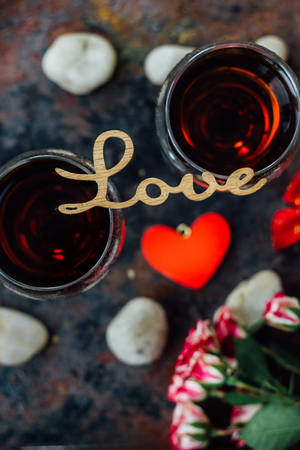 Beautiful letters LOVE on glasses of wine.の写真素材