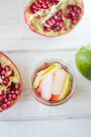 Top view of pomegranate lemonade with lime and ice.の写真素材