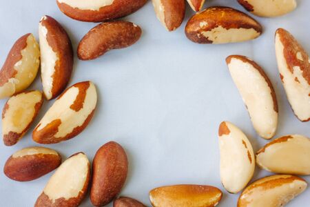 Brazil nuts over the white fabric materialの写真素材